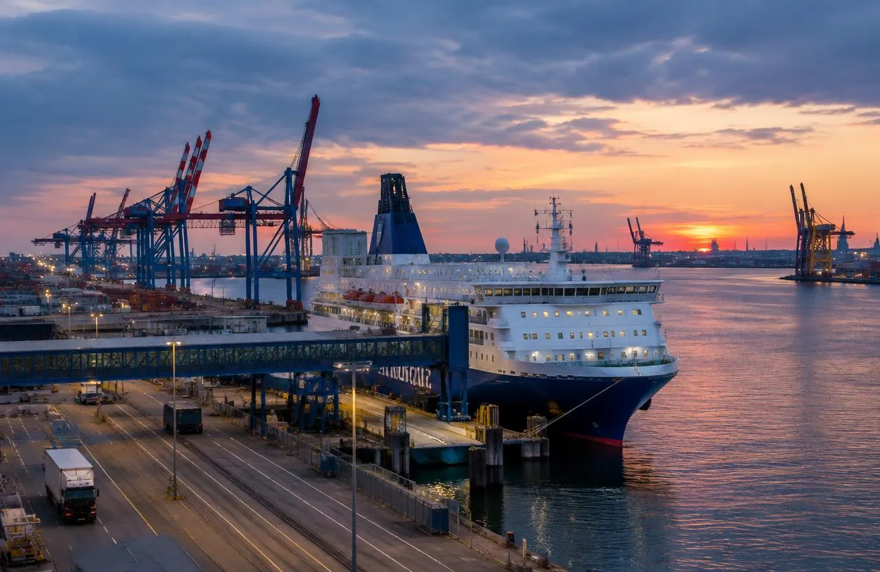 Large ferry docked at a German seaport terminal at dusk